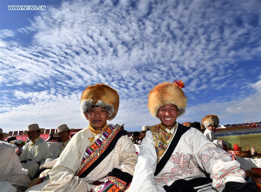 In pics: people wearing hats during horse racing festival in China's Tibet