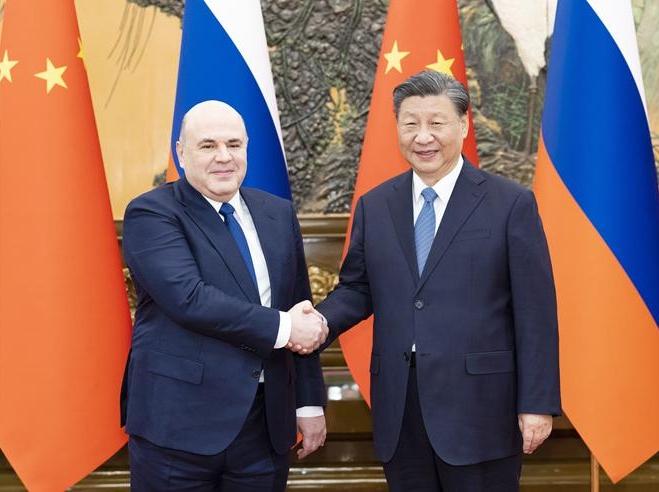 Xi meets with Russian PM