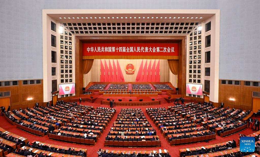 China's national legislature holds closing meeting of annual session