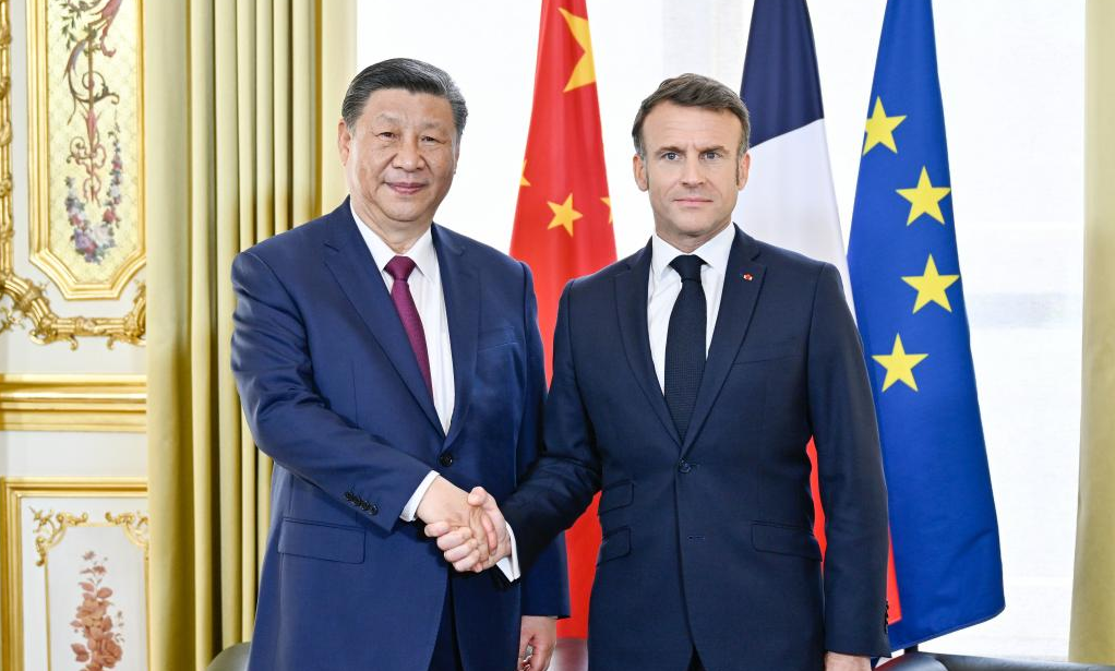 Xi, Macron hold talks in Paris