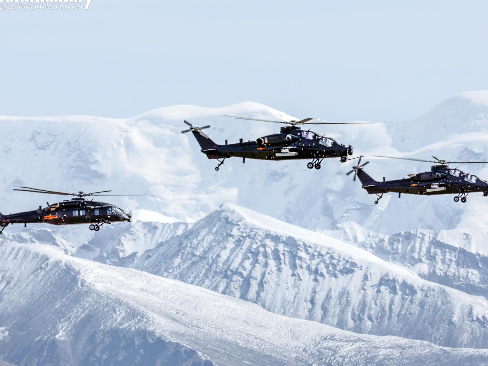 Helicopters fly in mountainous plateau area