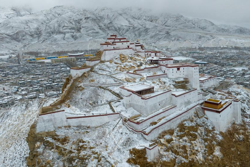 Snow scenery of ancient white castles on Mt. Dzongri in China's Xizang